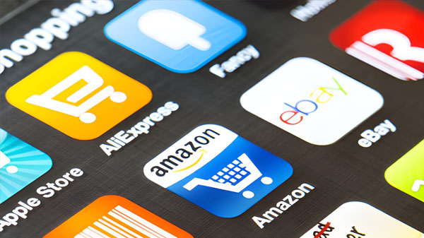 Tampilan ikon aplikasi eBay di layar smartphone, berdampingan dengan aplikasi belanja online lain seperti Amazon dan AliExpress.